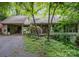 Inviting home exterior with a covered carport, lovely landscaping, and a charming front porch at 1102 Lake Montonia Rd, Kings Mountain, NC 28086