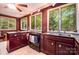 The kitchen features stainless steel sink, wood cabinets and backyard views at 1102 Lake Montonia Rd, Kings Mountain, NC 28086