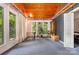 Inviting living area with wood ceiling, large windows, and access to backyard at 1102 Lake Montonia Rd, Kings Mountain, NC 28086