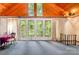 Comfortable living area featuring wooden ceilings, ample windows, and forest views at 1102 Lake Montonia Rd, Kings Mountain, NC 28086