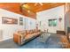 Bright living room with vaulted wood ceilings, a brick fireplace, and an open loft area above at 1102 Lake Montonia Rd, Kings Mountain, NC 28086