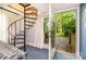 View of a room with a spiral staircase, opening to an outdoor wooded area at 1102 Lake Montonia Rd, Kings Mountain, NC 28086