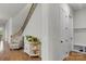 Inviting foyer with hardwood floors, staircase, and a decorative table for added charm at 1124 Greenbridge Dr, Matthews, NC 28105