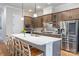 Gourmet kitchen featuring an island, stainless steel appliances, and sleek countertops at 1124 Greenbridge Dr, Matthews, NC 28105