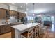 Open concept kitchen with island seating overlooks the living area, perfect for entertaining at 1124 Greenbridge Dr, Matthews, NC 28105