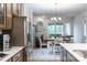 Kitchen features stainless steel appliances and opens to the dining and living areas at 1124 Greenbridge Dr, Matthews, NC 28105