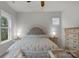 Bedroom with large windows, ceiling fan, and neutral colors for a tranquil retreat at 1124 Greenbridge Dr, Matthews, NC 28105