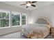 Bedroom with large windows and a comfortable seating area; lots of natural light at 1124 Greenbridge Dr, Matthews, NC 28105