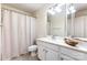 Clean bathroom featuring shower-tub combo, neutral walls and tiled floor at 1136 W 1St St, Charlotte, NC 28202