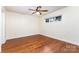 Bright bedroom featuring hardwood floors, ceiling fan and natural light at 1136 W 1St St, Charlotte, NC 28202