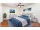 Comfortable bedroom with large window, ceiling fan, neutral walls, and an area rug at 1136 W 1St St, Charlotte, NC 28202