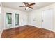 Bright bedroom with hardwood floors and double doors to the outside at 1136 W 1St St, Charlotte, NC 28202