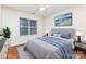 Staged bedroom with hardwood floors, neutral walls and coastal artwork at 1136 W 1St St, Charlotte, NC 28202