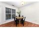 Well lit dining area featuring hardwood floors, natural lighting, and modern table with four chairs at 1136 W 1St St, Charlotte, NC 28202