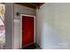 This property boasts a bright red front door and house number 1136 at 1136 W 1St St, Charlotte, NC 28202
