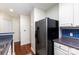 Well lit kitchen featuring stainless steel appliances, ample counter space, and blue tile backsplash at 1136 W 1St St, Charlotte, NC 28202