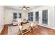 Bright living room with hardwood floors, ceiling fan, neutral colored walls, and natural light at 1136 W 1St St, Charlotte, NC 28202