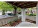 Covered patio with view of a street and greenery at 1136 W 1St St, Charlotte, NC 28202