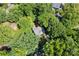 Aerial view of a two-story home with a gray roof surrounded by lush green trees at 116 Oak Creek Dr, Charlotte, NC 28270