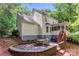 Landscaped backyard with a brick patio, dining table and chairs at 116 Oak Creek Dr, Charlotte, NC 28270