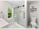 This bathroom features a glass shower with white subway tile and modern black hardware for a sleek look at 116 Oak Creek Dr, Charlotte, NC 28270