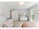 This bedroom has ample storage, natural light, and soft colors for a cozy and functional space at 116 Oak Creek Dr, Charlotte, NC 28270