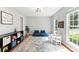 Versatile bonus room featuring ample natural light and a comfortable seating area at 116 Oak Creek Dr, Charlotte, NC 28270