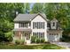 Charming two-story home boasts lush landscaping and a welcoming front porch at 116 Oak Creek Dr, Charlotte, NC 28270