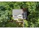 Aerial view of a two-story home with a gray roof and surrounded by lush green trees at 116 Oak Creek Dr, Charlotte, NC 28270