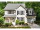 Charming two-story home with well-manicured landscaping and a covered porch at 116 Oak Creek Dr, Charlotte, NC 28270