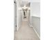 Long hallway with neutral carpet and lighting at 116 Oak Creek Dr, Charlotte, NC 28270