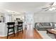 Spacious living room featuring a breakfast bar connecting to the kitchen at 116 Oak Creek Dr, Charlotte, NC 28270