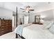This main bedroom showcases a four-poster bed and an elegant mirror that reflects the light and decor at 116 Oak Creek Dr, Charlotte, NC 28270
