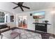 Spacious screened porch with a ceiling fan and a TV at 116 Oak Creek Dr, Charlotte, NC 28270
