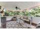 Relaxing screened porch with comfortable seating and a ceiling fan at 116 Oak Creek Dr, Charlotte, NC 28270