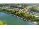 Stunning aerial view of waterfront homes, private boat docks and serene lake, ideal for boating enthusiasts at 117 Langhorne Dr, Mount Holly, NC 28120