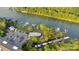 Aerial view of waterfront community clubhouse with ample parking, boat docks, and lake access at 117 Langhorne Dr, Mount Holly, NC 28120