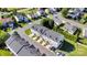 Aerial view of townhome community highlighting rooflines and community layout at 117 Langhorne Dr, Mount Holly, NC 28120