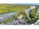 Beautiful aerial view of waterfront restaurant, boat docks, parking, and lake, perfect for dining and recreation at 117 Langhorne Dr, Mount Holly, NC 28120