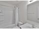 Clean bathroom featuring a tub/shower combo, a single vanity, and white tile at 117 Langhorne Dr, Mount Holly, NC 28120
