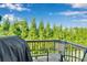 Outdoor deck space complete with chairs and grill, offering a tranquil setting at 117 Langhorne Dr, Mount Holly, NC 28120