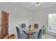 Cozy dining area features a round glass table and natural light from the door at 117 Langhorne Dr, Mount Holly, NC 28120