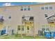 Exterior view of the home showcasing the back porch, and tidy yard at 117 Langhorne Dr, Mount Holly, NC 28120