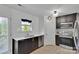 Modern kitchen featuring stainless steel appliances, dark cabinetry, and a bright window at 117 Langhorne Dr, Mount Holly, NC 28120