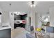 Updated kitchen with stainless steel appliances and dark cabinets, adjacent to dining area at 117 Langhorne Dr, Mount Holly, NC 28120