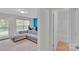 Brightly lit living room with access to a bathroom at 117 Langhorne Dr, Mount Holly, NC 28120