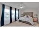 Bright and airy main bedroom with large windows and a plush, upholstered bed at 117 Langhorne Dr, Mount Holly, NC 28120
