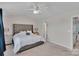 Main bedroom with tufted headboard, soft carpet, and ample natural light at 117 Langhorne Dr, Mount Holly, NC 28120