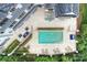An aerial view of the backyard showing a pool, stone patio, and meticulous landscaping at 11710 Ney Manor Way, Charlotte, NC 28277