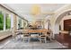 Formal dining room featuring a large wooden table and decorative lighting at 11710 Ney Manor Way, Charlotte, NC 28277
